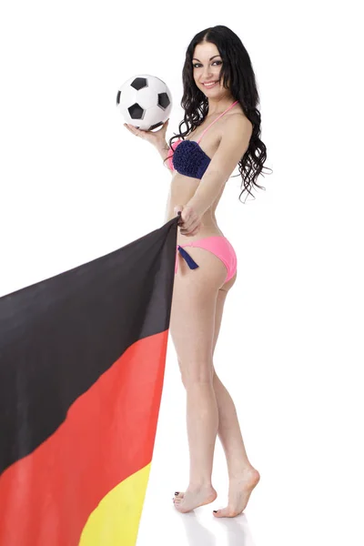 Abanico de fútbol sexy en bikini con pelota en la mano y bandera alemana — Foto de Stock