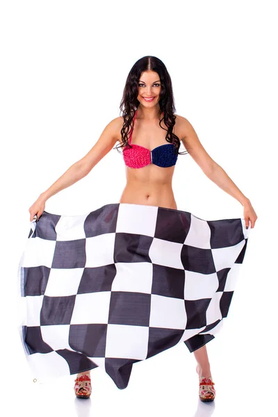 Young woman holding a large checkered flag — Stock Photo, Image