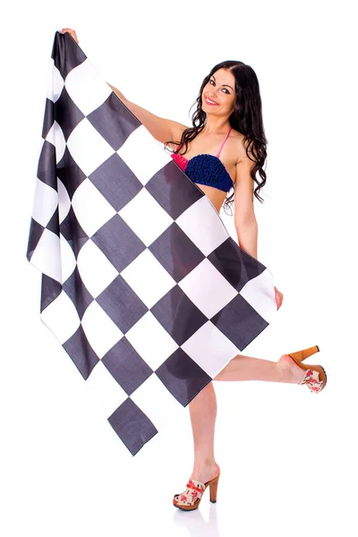 Büyük bir damalı bayrak tutan genç kadın — Stok fotoğraf