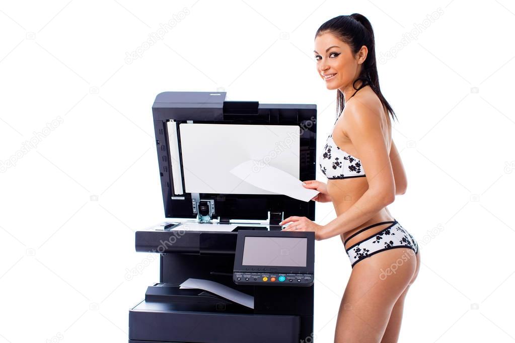 Sexy young beautiful woman in bikini making copies