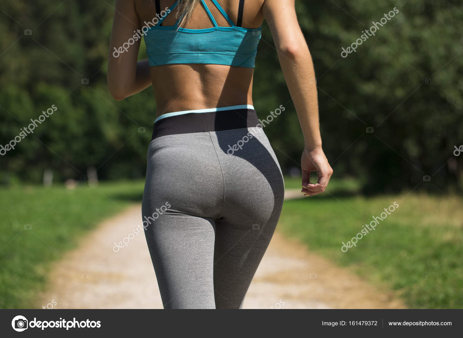 Close up sexy ass. Athletic woman working out Stock Photo by ©arkusha  161479372