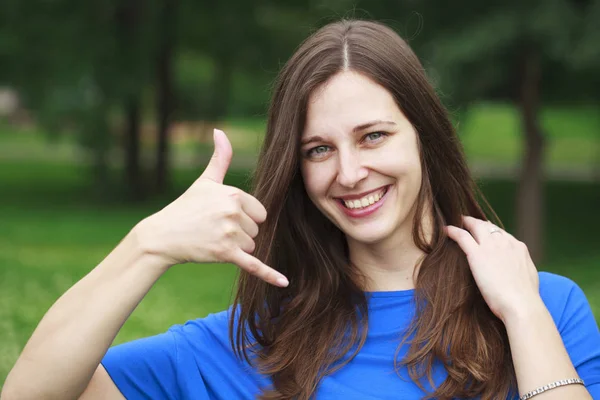 Beautiful woman making a call me gesture — Stock Photo, Image