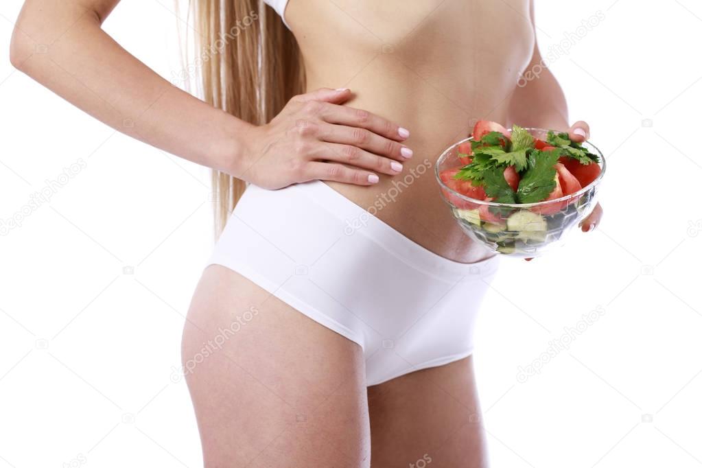 Dietary salad and slender female figure