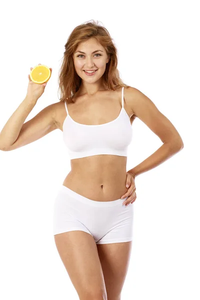 Young beautiful blonde woman in white fitness clothing — Stock Photo, Image