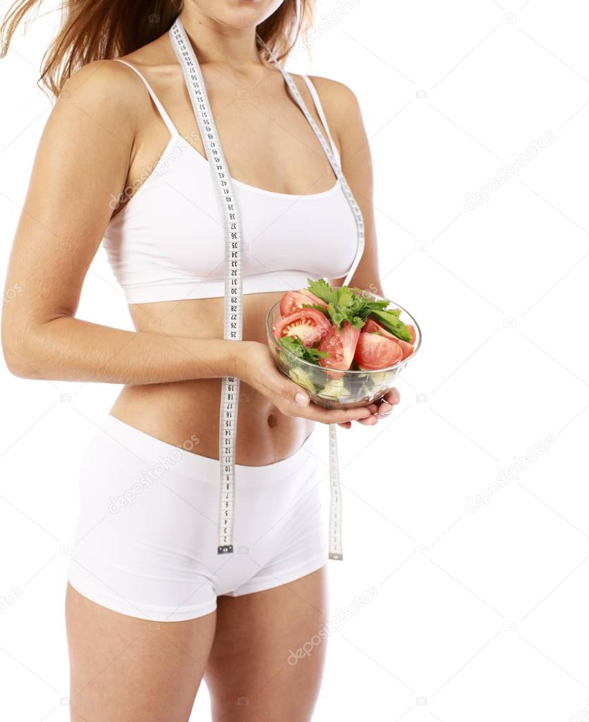 Dietary salad and slender female figure