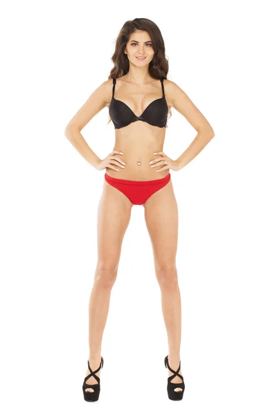 Full längd porträtt av ung kvinna som bär sexiga underkläder — Stockfoto
