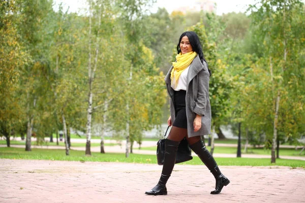 Portrait of a young beautiful woman in gray coat — Stock Photo, Image