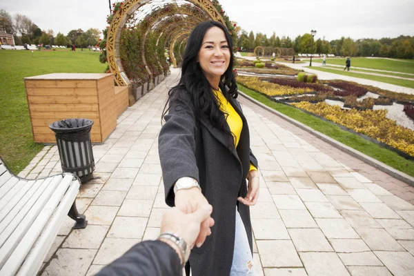 Beautiful sexy young woman holds the hand of a man — Stock Photo, Image