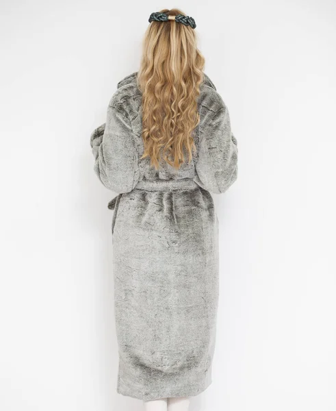 Beautiful young woman in gray fur coat — Stock Photo, Image