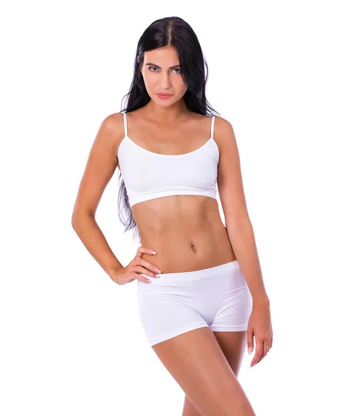 Sexy vrouw in witte fitness kleding — Stockfoto