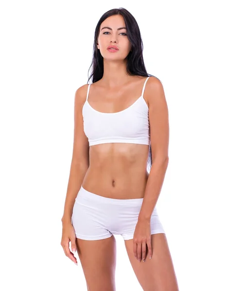 Sexy vrouw in witte fitness kleding — Stockfoto