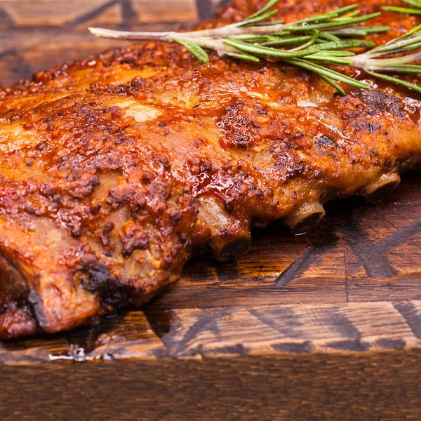 Closeup of pork ribs grilled with BBQ sauce — Stock Photo, Image