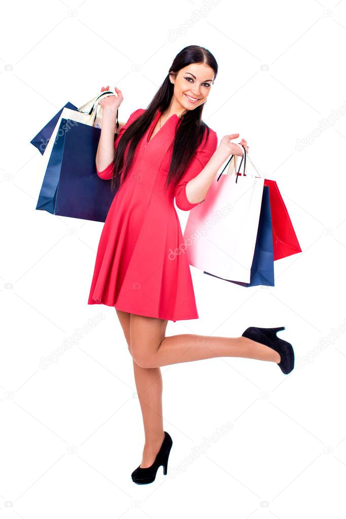 Young brunette woman with some shopping bags 