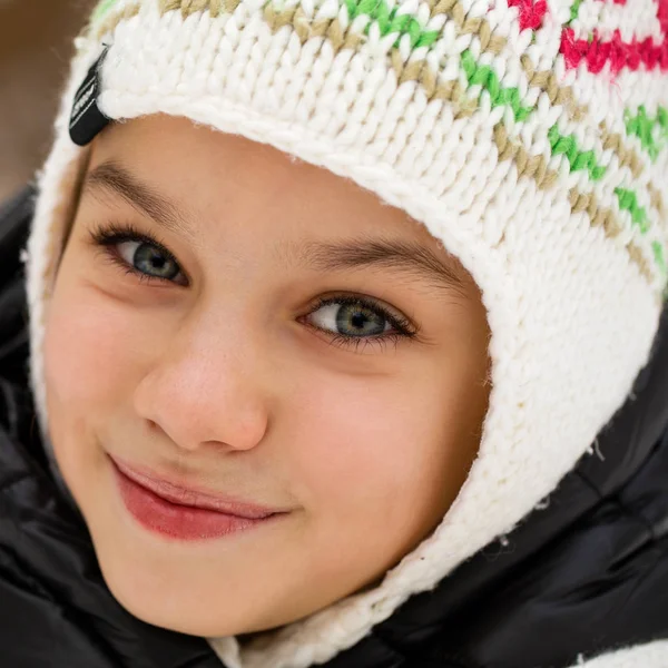 Close up portrait of a cute little girl in winter time — Stock Photo, Image