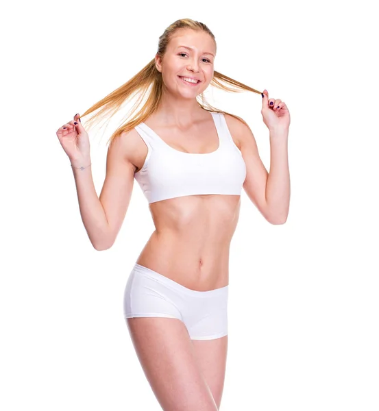 Joven hermosa mujer rubia en ropa de fitness blanca —  Fotos de Stock