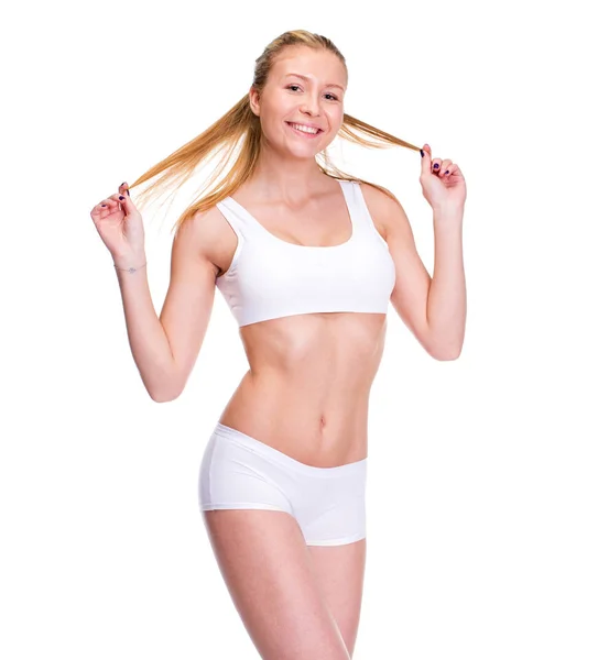 Jeune belle femme blonde en vêtements de fitness blanc — Photo