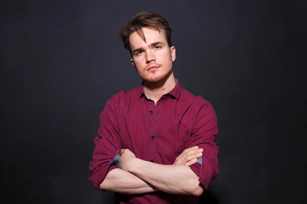 Studio portrait of young man on a dark background — Stock Photo, Image