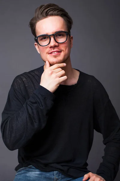 Studio portrait of a young man in big glasses — Stock Photo, Image