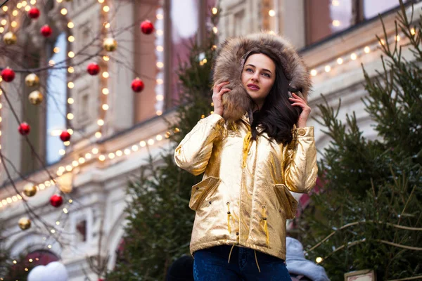 Young beautiful woman in golden jacket — Stock Photo, Image