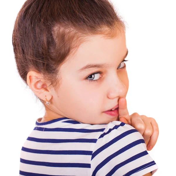 Little girl has put forefinger to lips as sign of silence — Stock Photo, Image