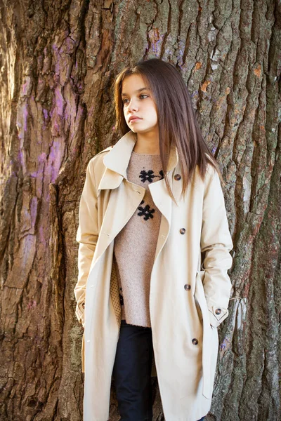 Happy young little girl in beige coat — Stock Photo, Image