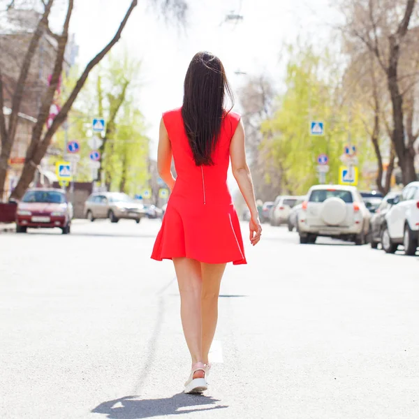 Back view close up portrait young beautiful brunette woman in re — Stock Photo, Image