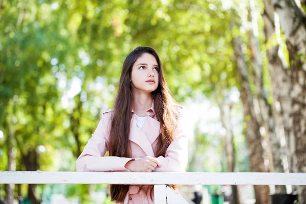 Close up brunette girl in summer park background — Stock Photo, Image