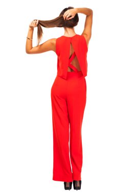 Arkadan Görünüm. Kırmızı pantolon takım genç esmer kadın