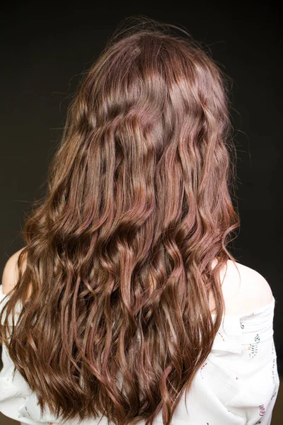 Hair back, young woman with open shoulders