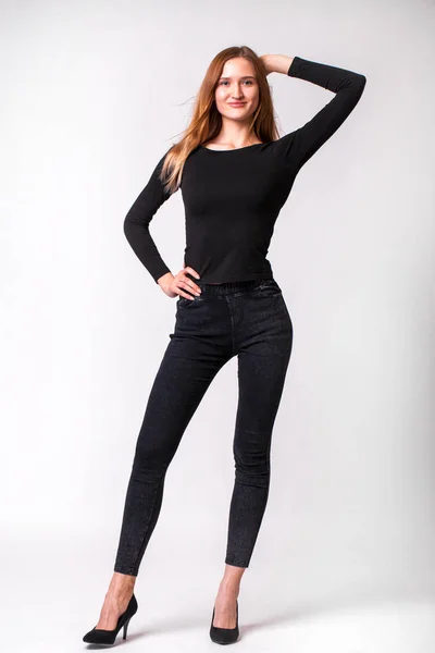 Beautiful sexy woman in black jeans — 스톡 사진