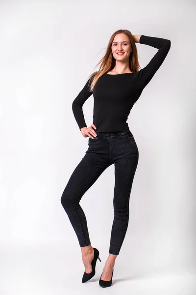 Beautiful sexy woman in black jeans — 스톡 사진