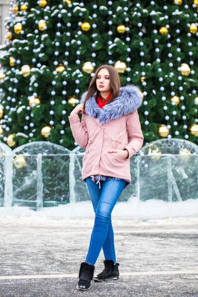 Young beautiful woman in blue jeans and fur jacket — 스톡 사진
