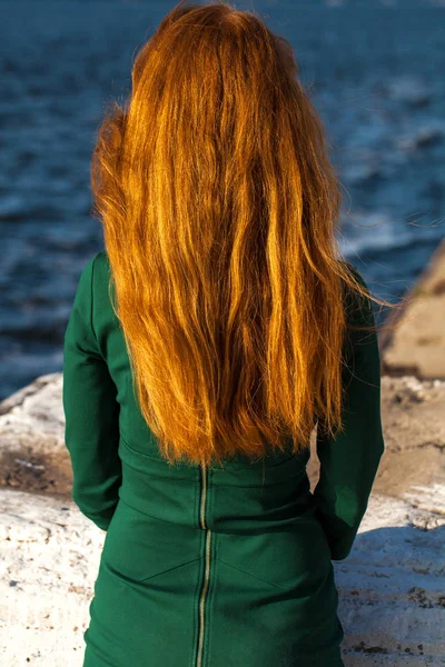 Back view female red-haired girl