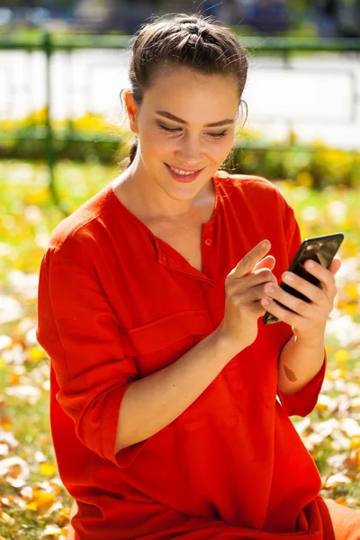 Portrait close up of young beautiful brunette woman in red shirt — Stock Photo, Image