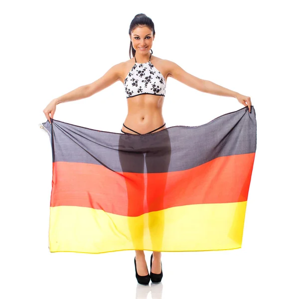 若いです美しいですブルネット女性でビキニホールドアップドイツの明確な旗 — ストック写真