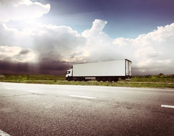 Highway transportation with car and Truck Stock Image