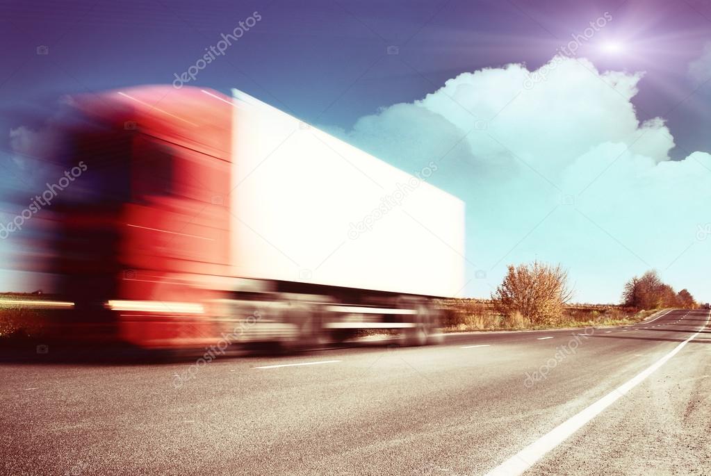Trucks traveling on an asphalt highway 