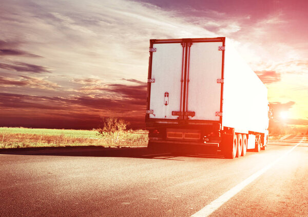 truck on road in sunset