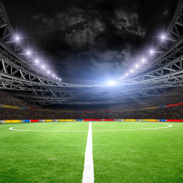 Soccer field with green grass and lights