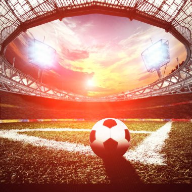 Yeşil çimenli ve ışıklı futbol sahası 