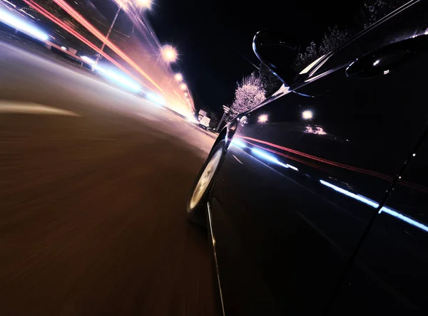 Fast car on the night city roar — Stock Photo, Image