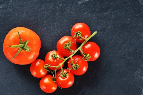 One big tomato with tomatoes