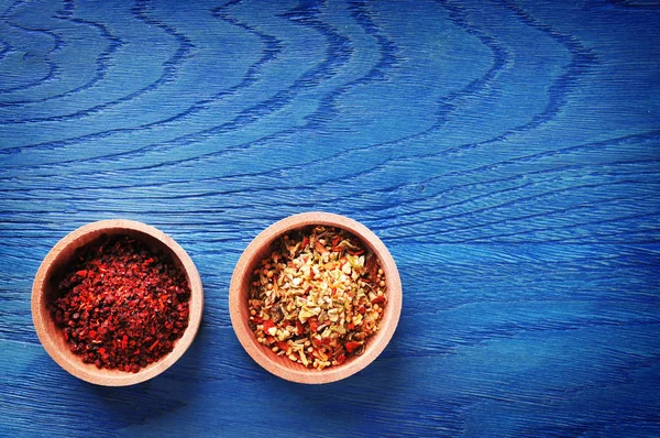 Different spices in wooden bowls — Stock Photo, Image