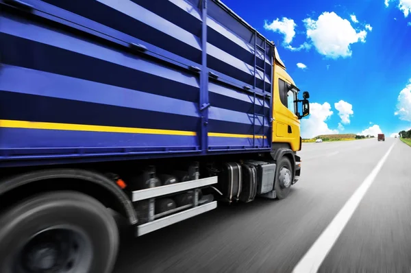 Yellow Truck Motion Blue Container Driving Countryside Road Blue Sky — Stock Photo, Image