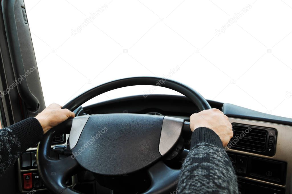 Truck dashboard with drivers hands on the steering wheel against isolated on a white background