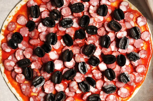 Closeup Sliced Black Olives Sausages Ketchup Sauce Pizza Dough — Stock Photo, Image