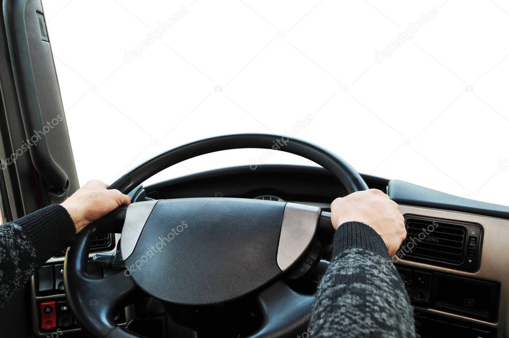 Truck dashboard with drivers hands on the steering wheel against isolated on white background