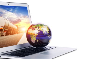 World globe on the silver laptop with a white screen isolated on white background clipart