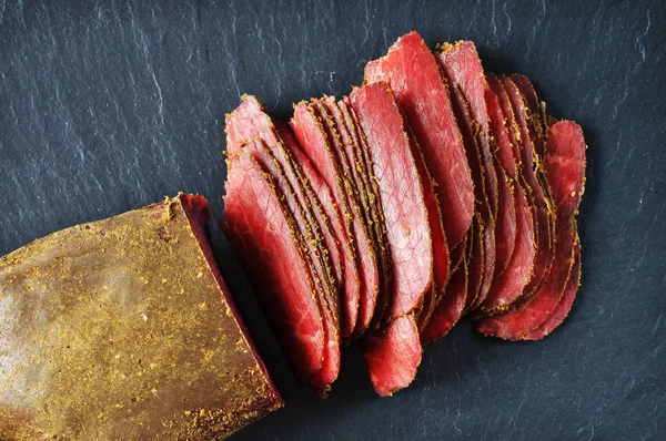 Sliced Cured Red Meat Dark Blue Background — Stock Photo, Image