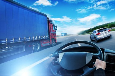 Abstract background with truck with trailer, truck steering wheel and silver family car against sky with blue lights